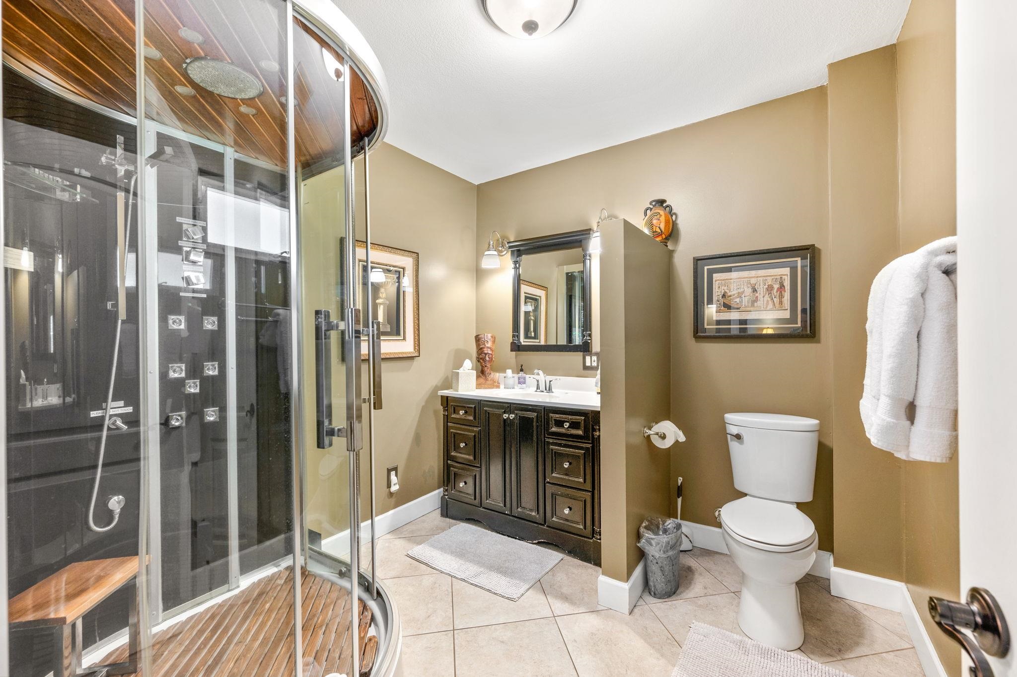 89 Cedar Street St. Augustine, FL 32084 - Photo 43 of 100 a bathroom with a toilet sink and shower