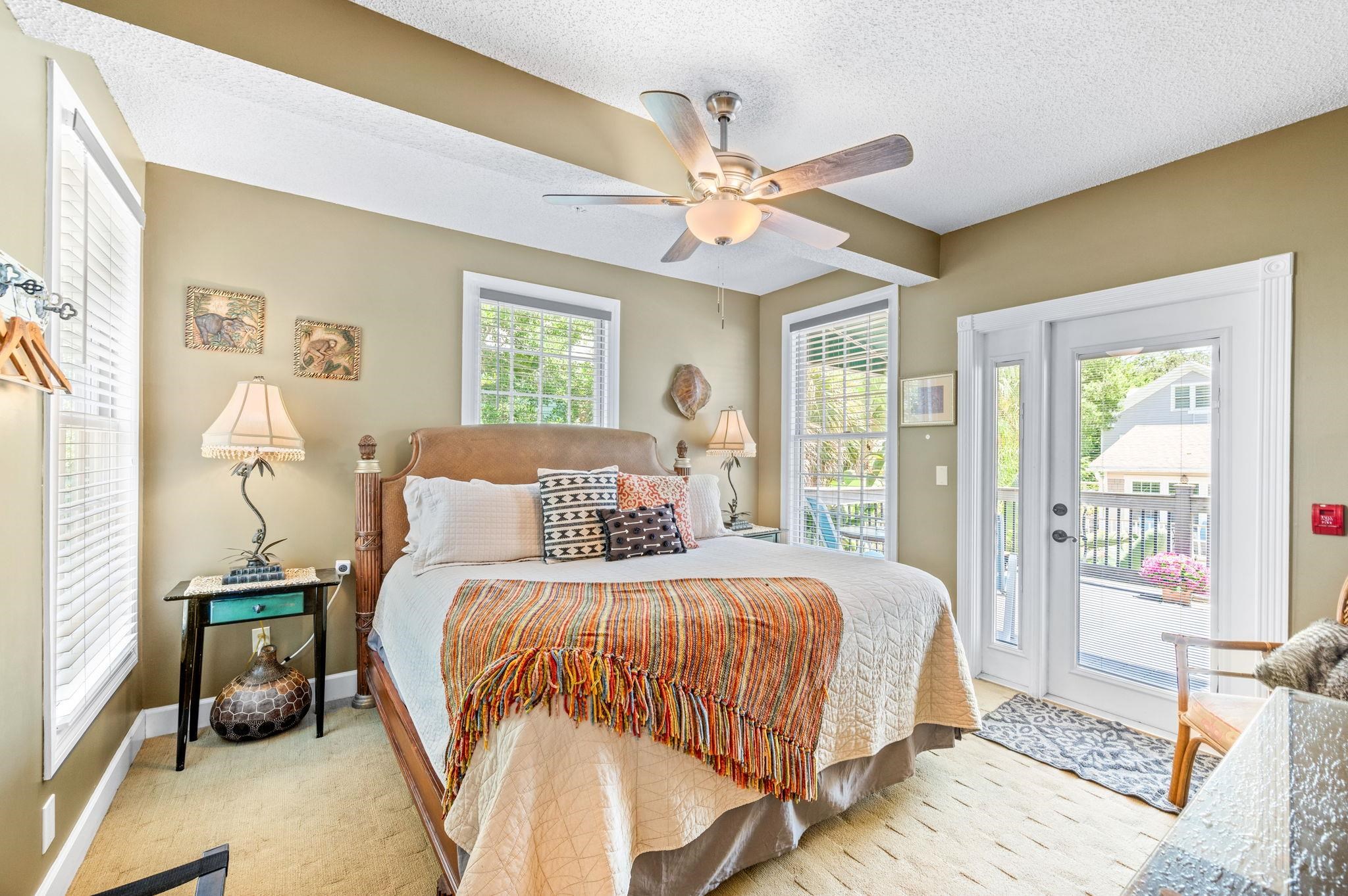 89 Cedar Street St. Augustine, FL 32084 - Photo 47 of 100 a bedroom with a bed and a chandelier