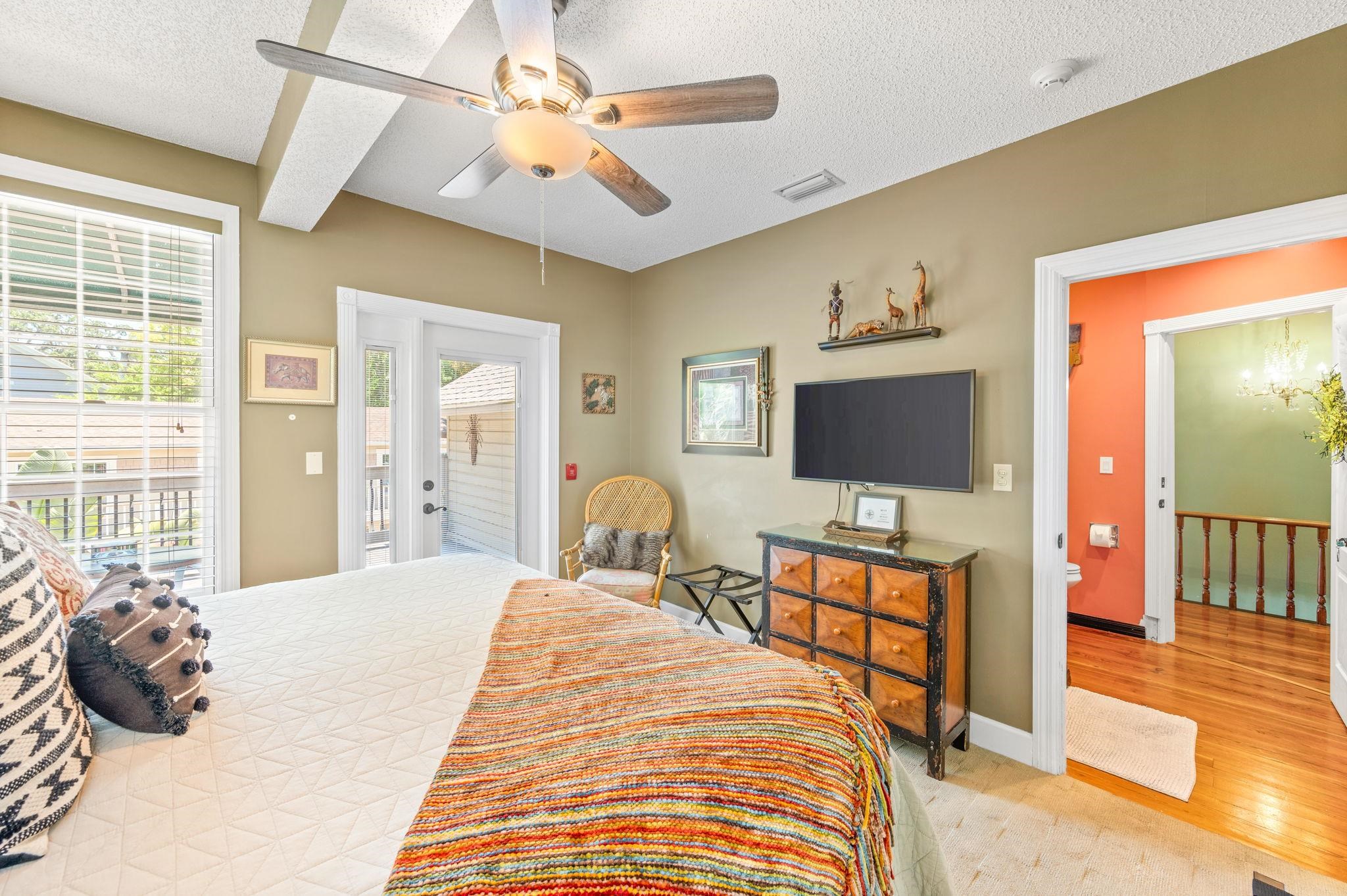 89 Cedar Street St. Augustine, FL 32084 - Photo 48 of 100 a bedroom with a bed and a flat tv screen on dresser