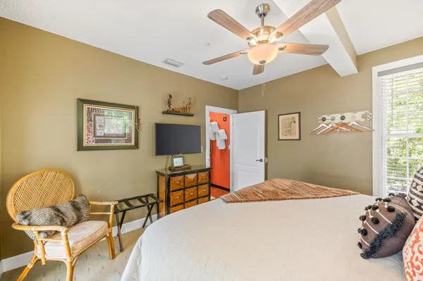 an aerial view of multiple houses with a yard