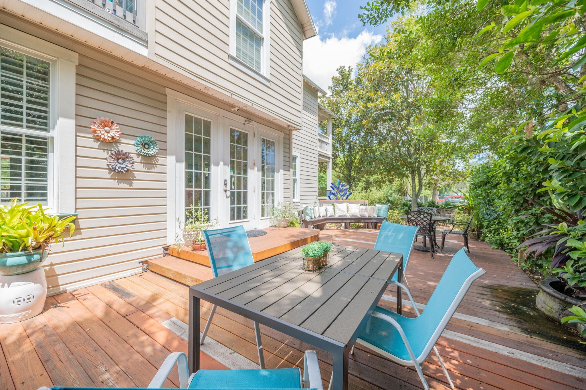 89 Cedar Street St. Augustine, FL 32084 - Photo 56 of 100 a view of a patio with table and chairs and potted plants