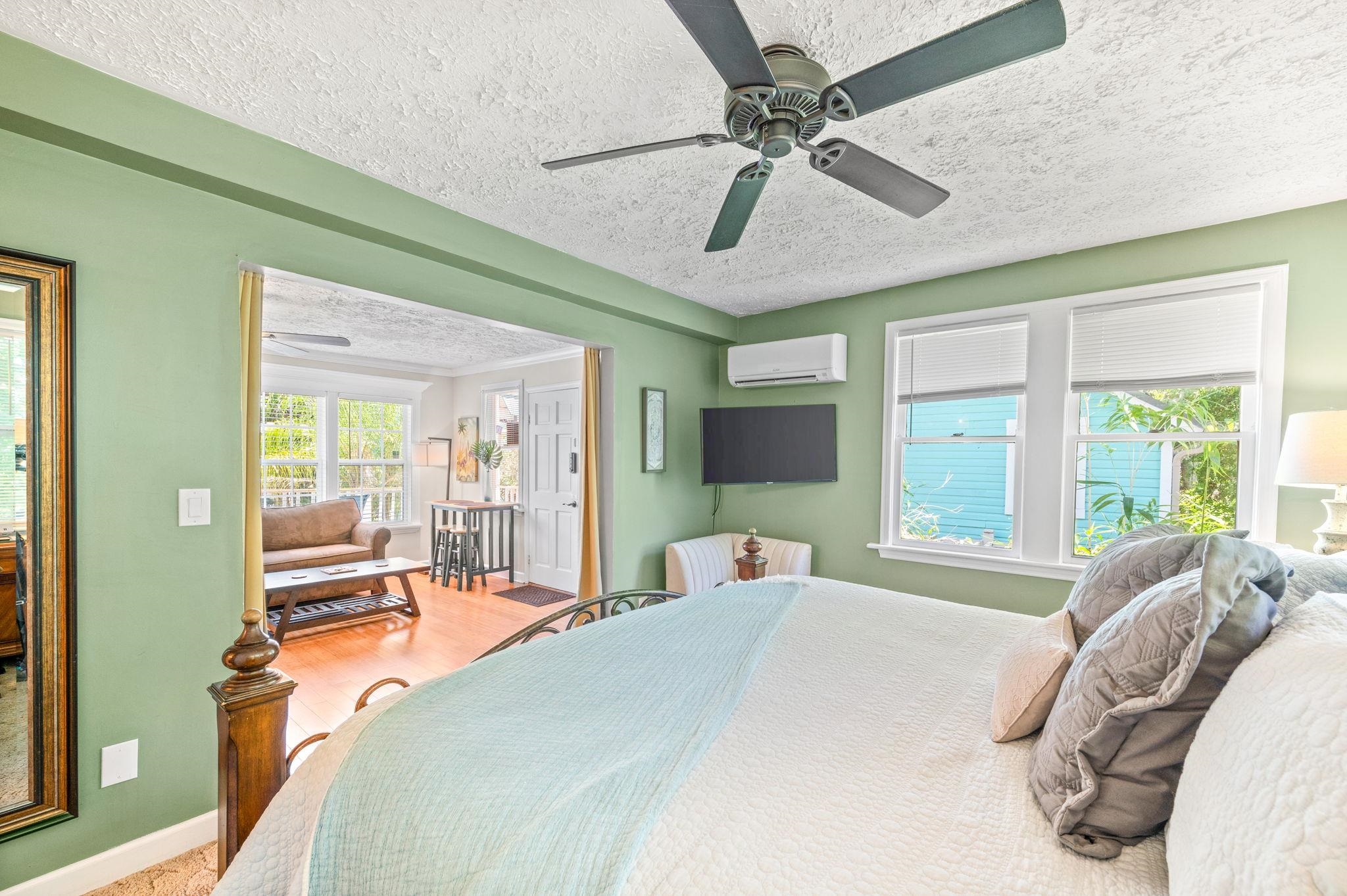 89 Cedar Street St. Augustine, FL 32084 - Photo 73 of 100 a bedroom with a bed ceiling fan and a large window