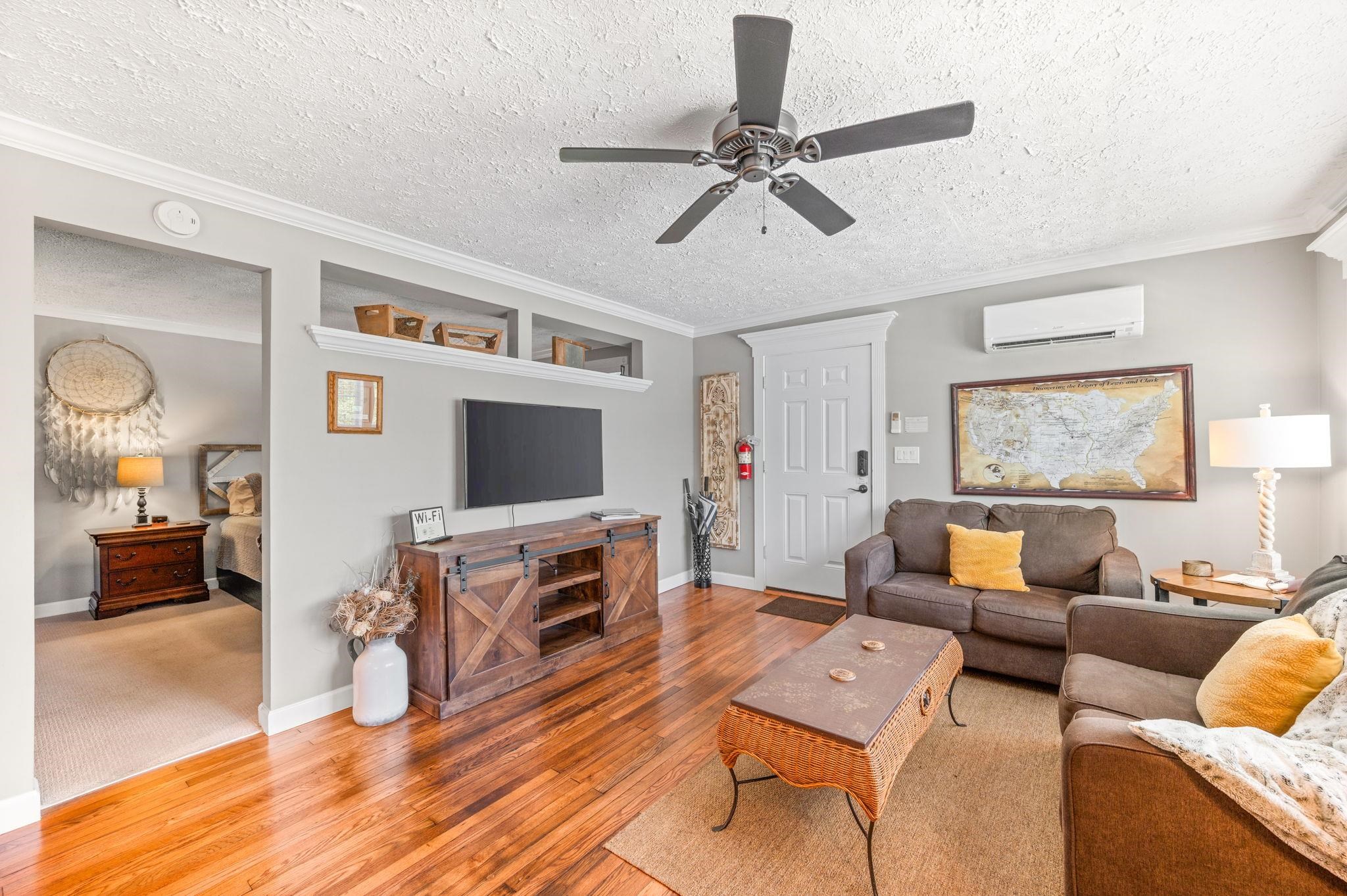 89 Cedar Street St. Augustine, FL 32084 - Photo 78 of 100 a living room with furniture and a flat screen tv