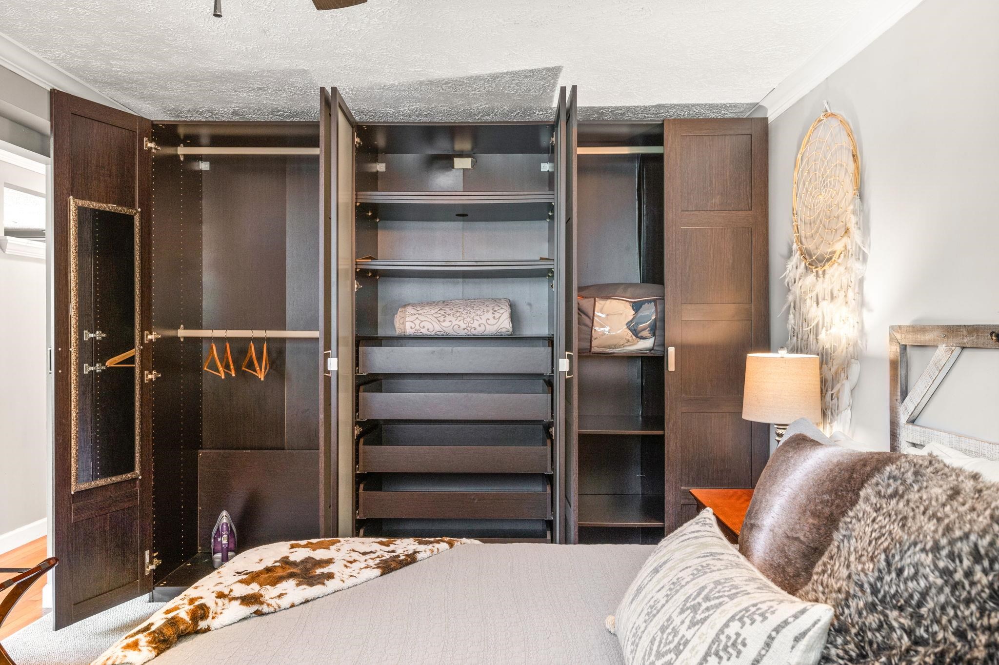 89 Cedar Street St. Augustine, FL 32084 - Photo 84 of 100 a bedroom with a bed and a walk in closet