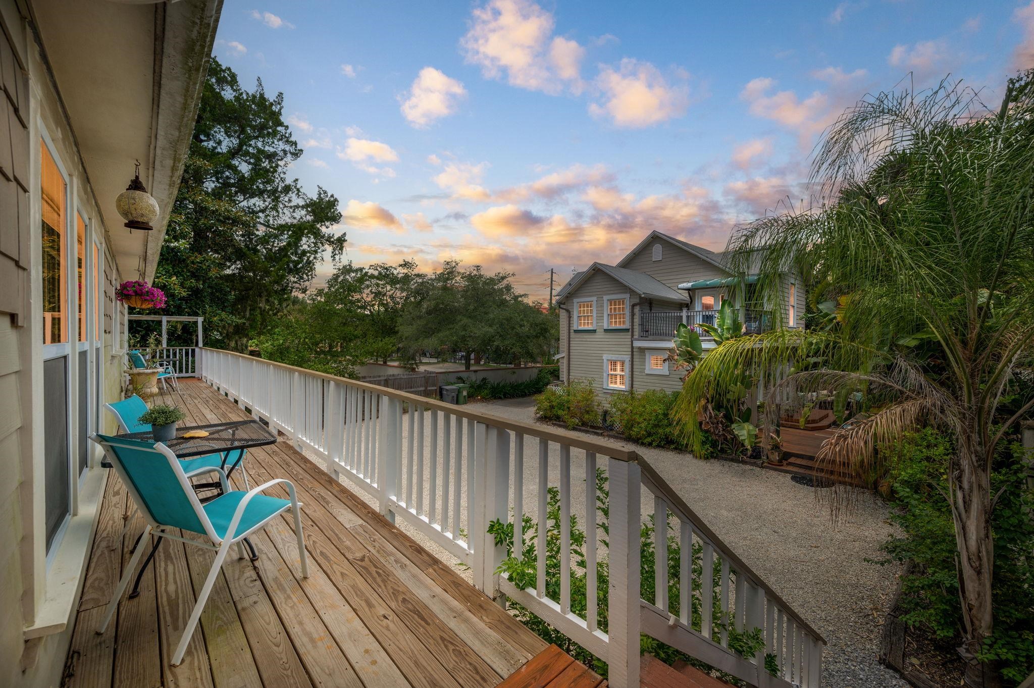89 Cedar Street St. Augustine, FL 32084 - Photo 97 of 100 a balcony with wooden floor and outdoor seating
