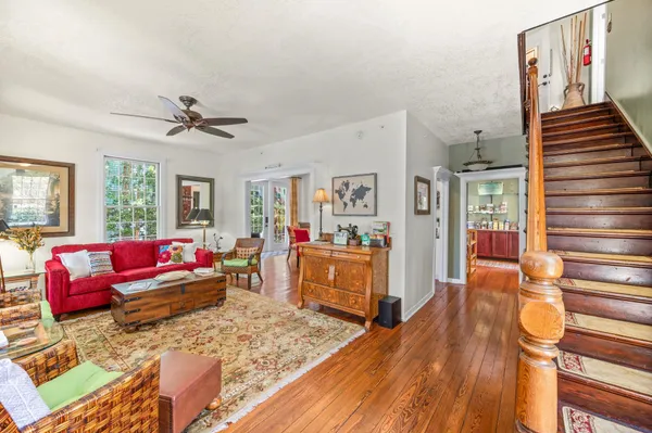 a view of a dining room with furniture window and wooden floor