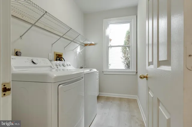 a spacious bathroom with double vanity a mirror a bathtub and shower