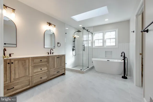 a view of a hallway with wooden floor and windows