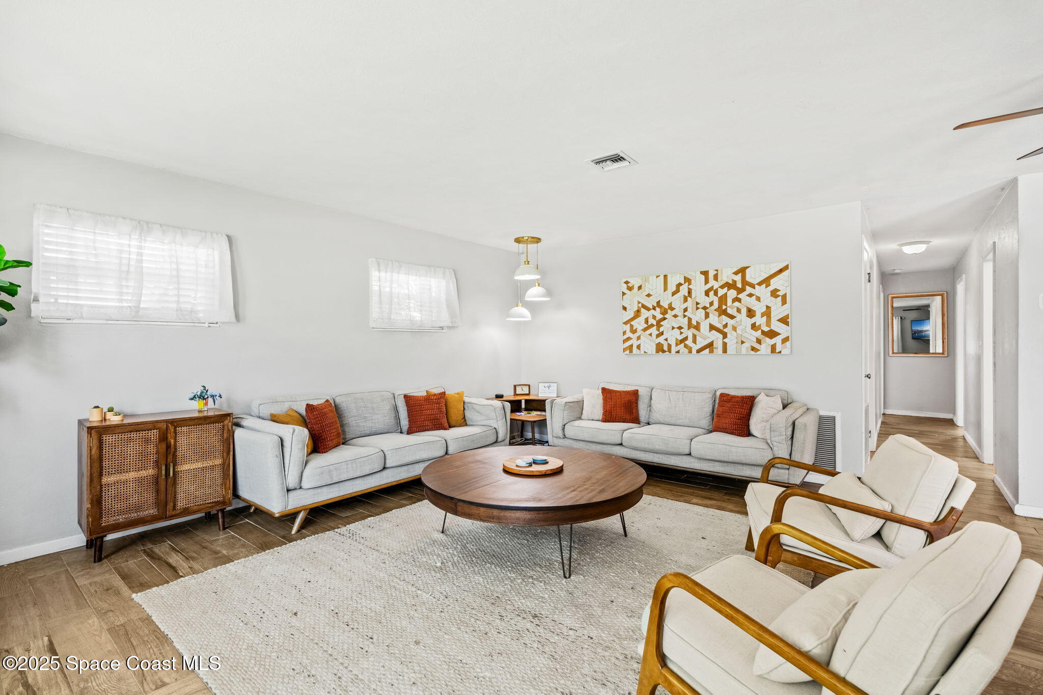 411 Poinsettia Road Melbourne Beach, FL 32951 - Photo 11 of 78 a living room with furniture and a rug