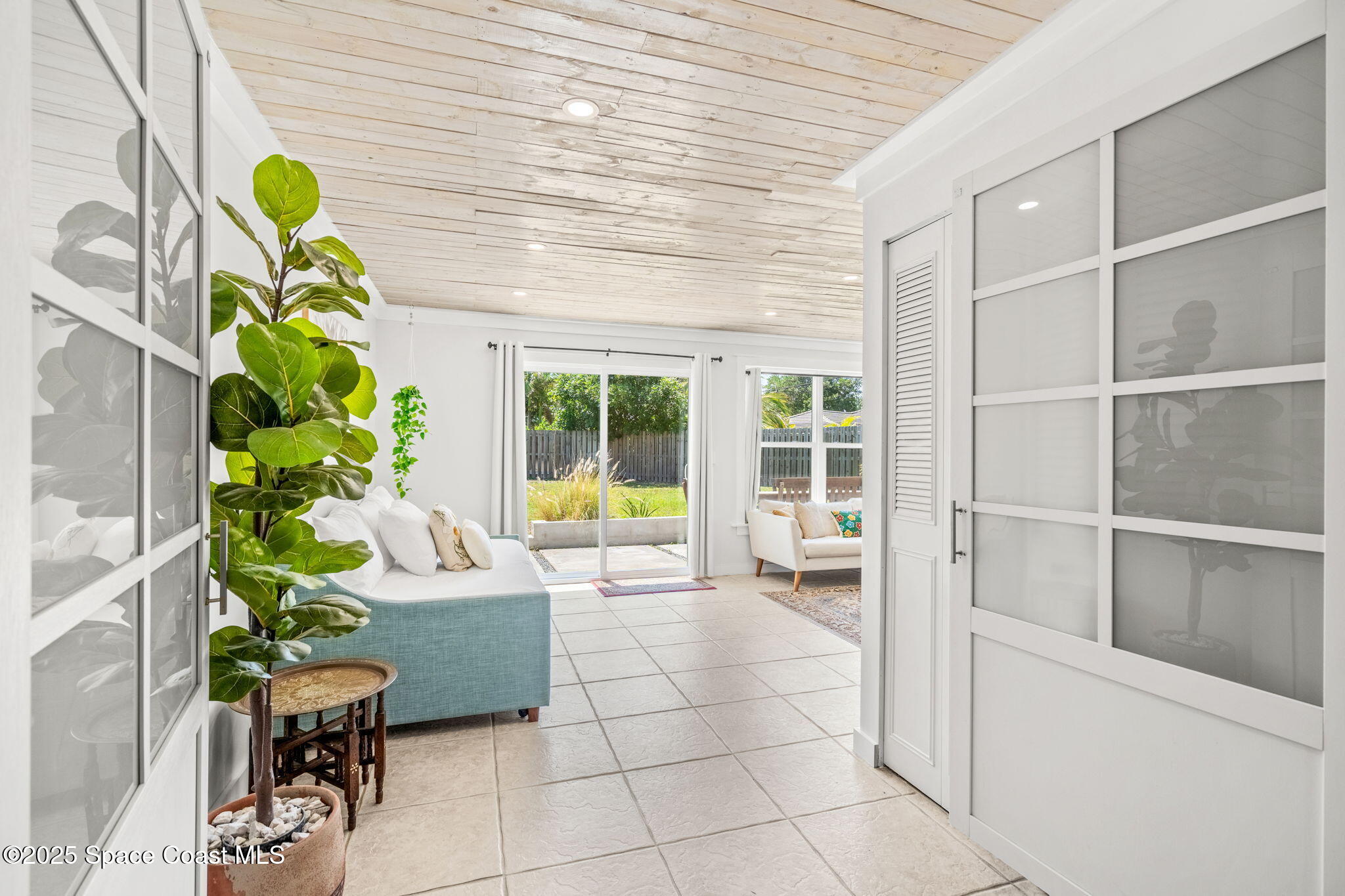 411 Poinsettia Road Melbourne Beach, FL 32951 - Photo 22 of 78 a living room filled with furniture