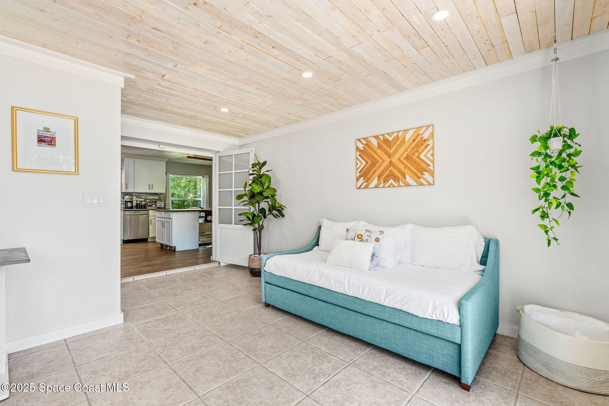 411 Poinsettia Road Melbourne Beach, FL 32951 - Photo 23 of 78 a living room with furniture and a potted plant