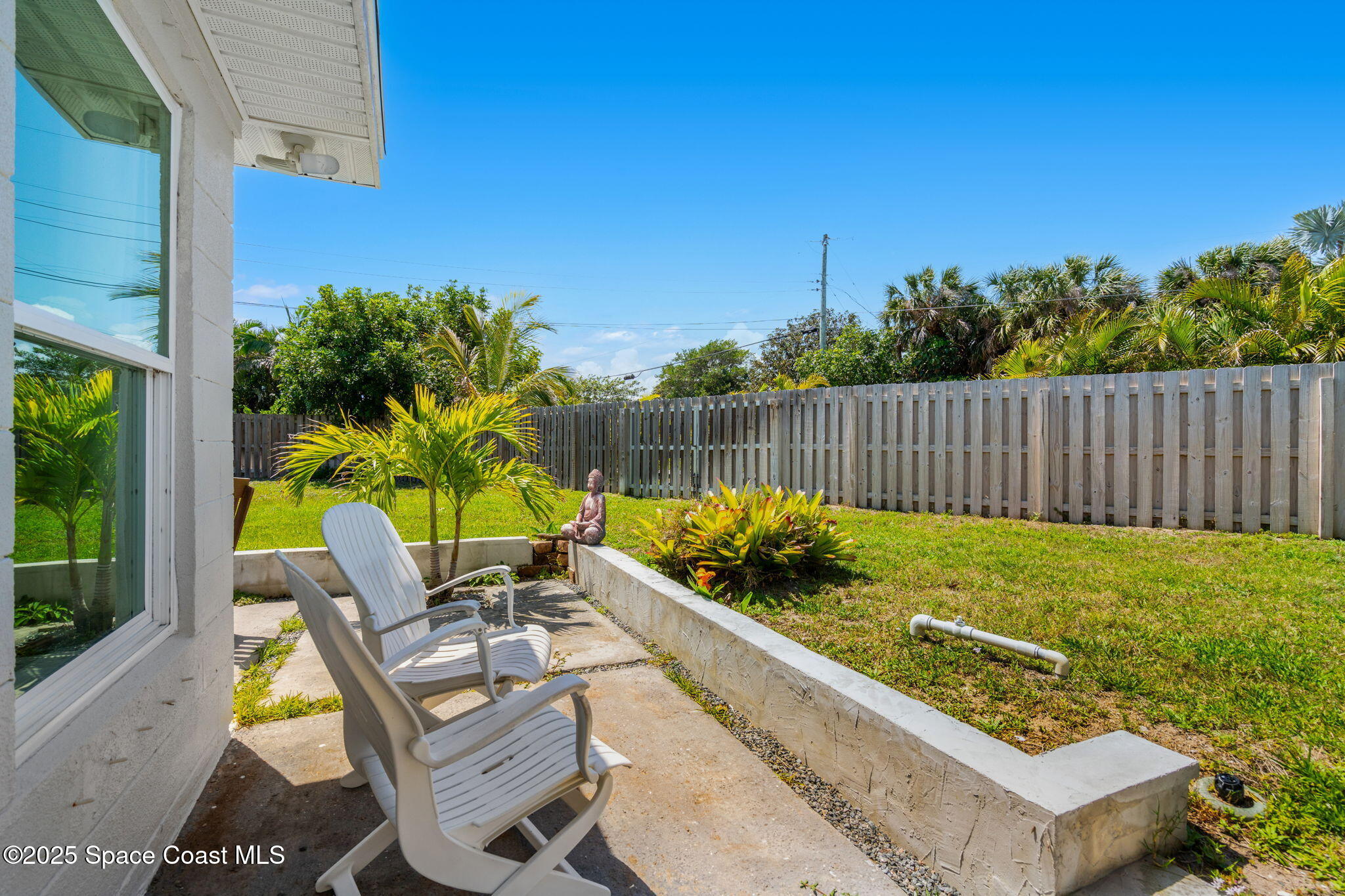 411 Poinsettia Road Melbourne Beach, FL 32951 - Photo 31 of 78 a view of backyard with seating space