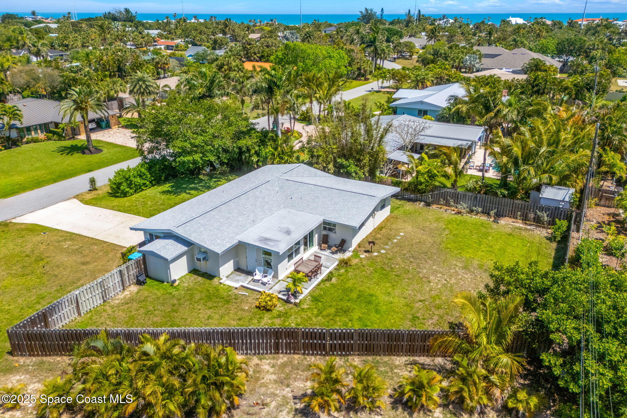 411 Poinsettia Road Melbourne Beach, FL 32951 - Photo 38 of 78 an aerial view of residential houses with outdoor space and swimming pool