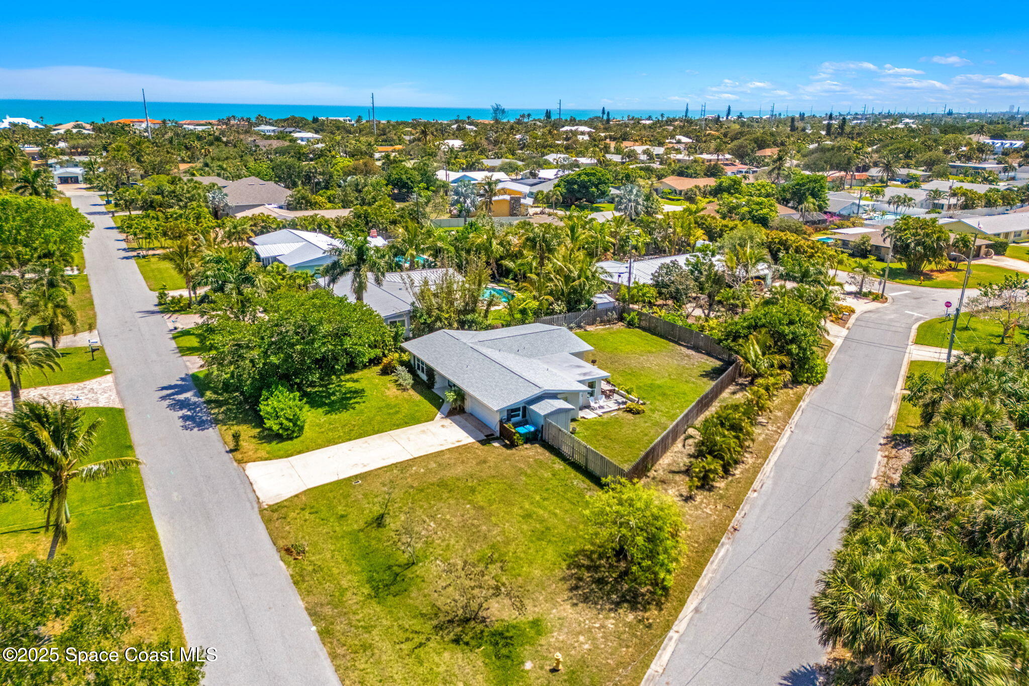 411 Poinsettia Road Melbourne Beach, FL 32951 - Photo 40 of 78 an aerial view of residential houses with outdoor space