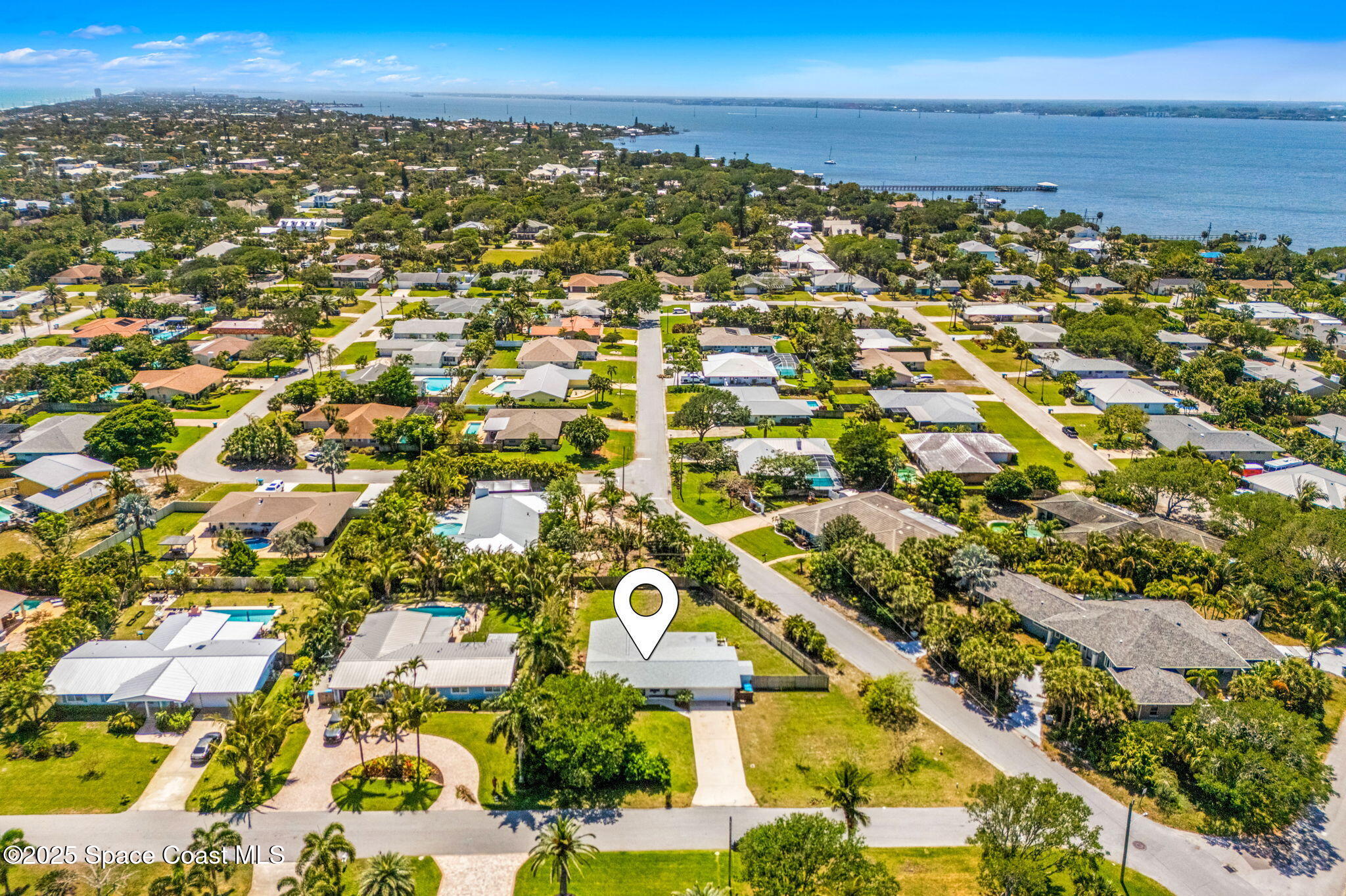 411 Poinsettia Road Melbourne Beach, FL 32951 - Photo 43 of 78 an aerial view of residential building and ocean