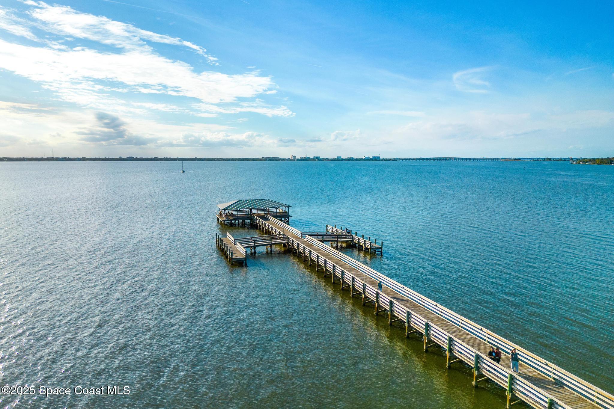 411 Poinsettia Road Melbourne Beach, FL 32951 - Photo 48 of 78 a view of a lake with lawn chairs