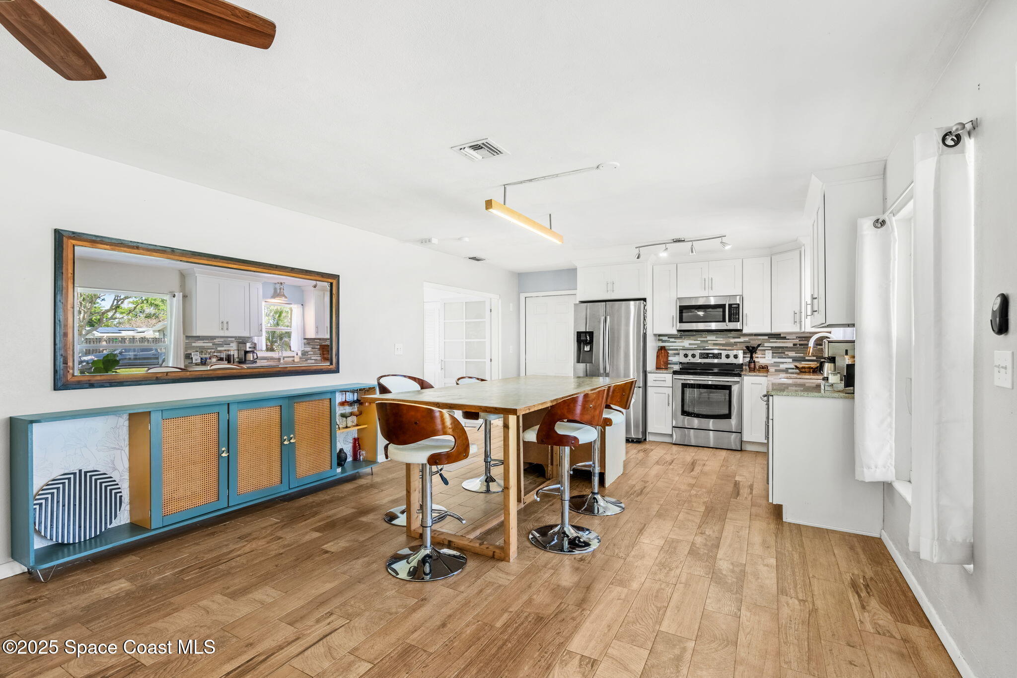 411 Poinsettia Road Melbourne Beach, FL 32951 - Photo 5 of 78 a view of kitchen with cabinets table and chairs