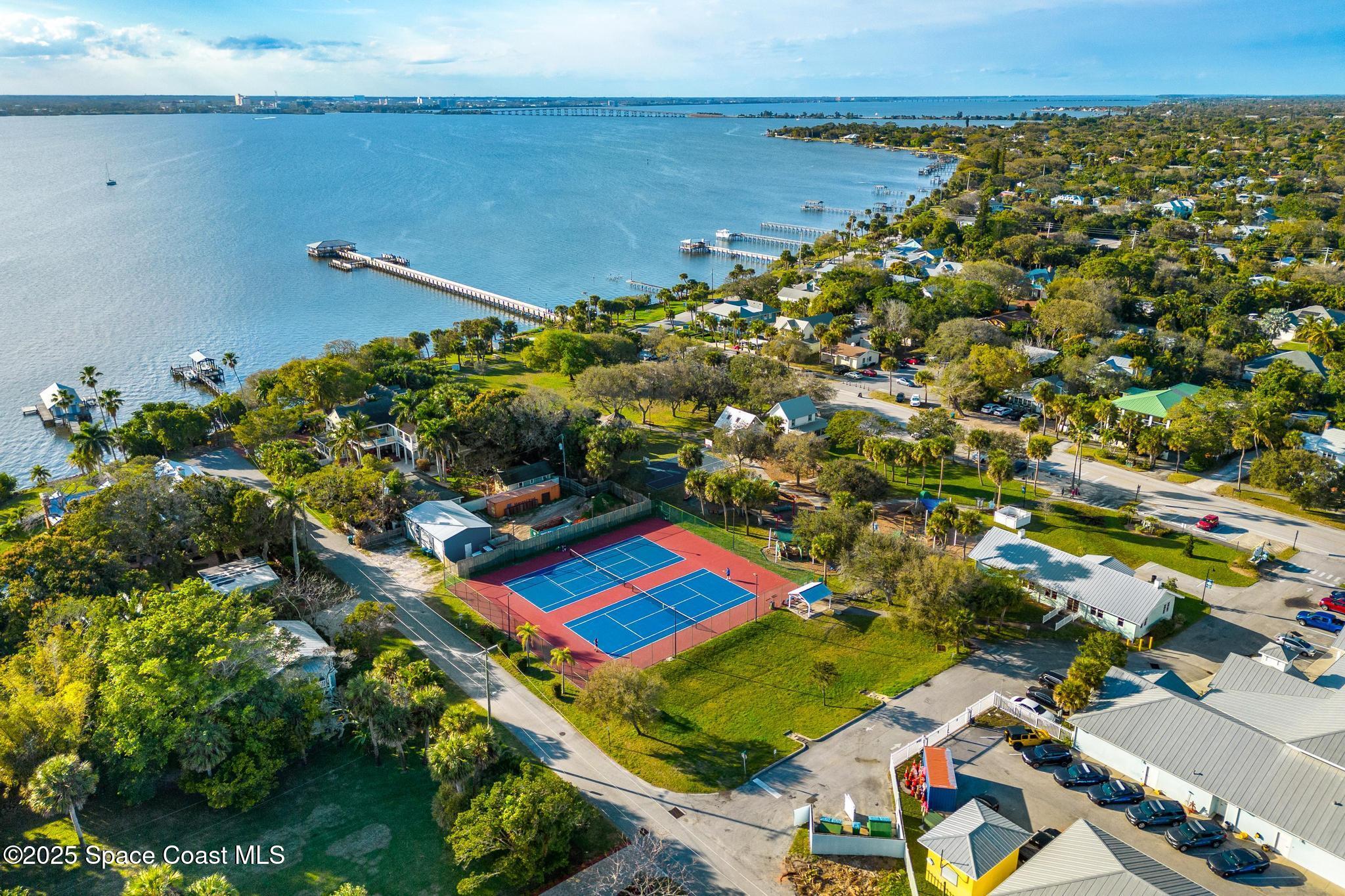 411 Poinsettia Road Melbourne Beach, FL 32951 - Photo 51 of 78 an aerial view of multiple house