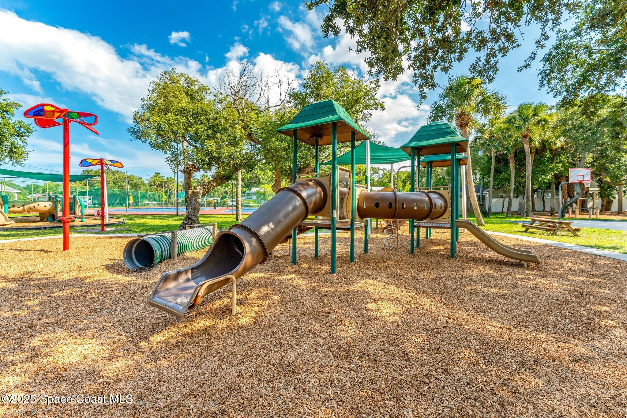 411 Poinsettia Road Melbourne Beach, FL 32951 - Photo 54 of 78 a view of a park with slide