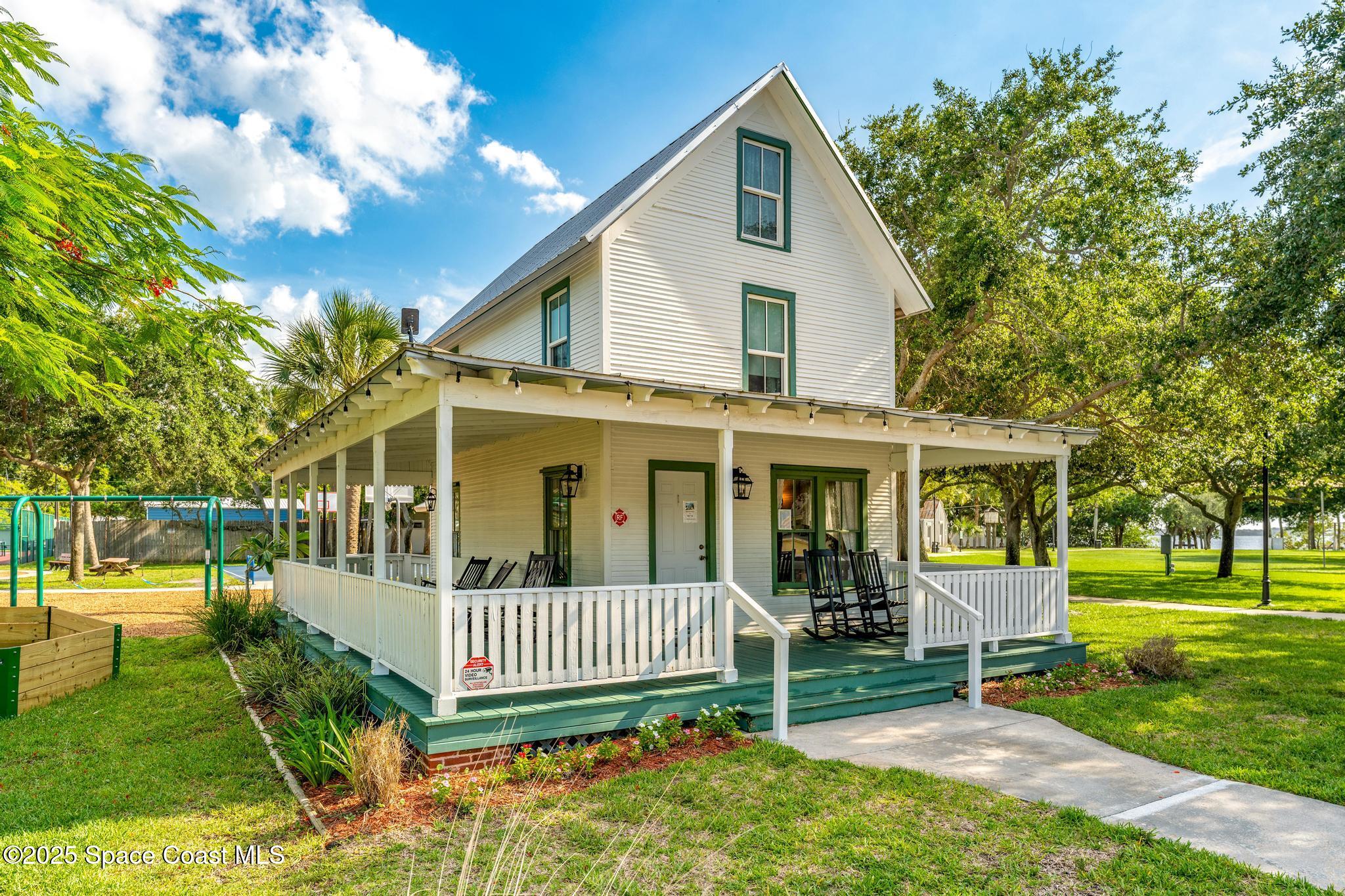 411 Poinsettia Road Melbourne Beach, FL 32951 - Photo 58 of 78 a view of a house with a yard