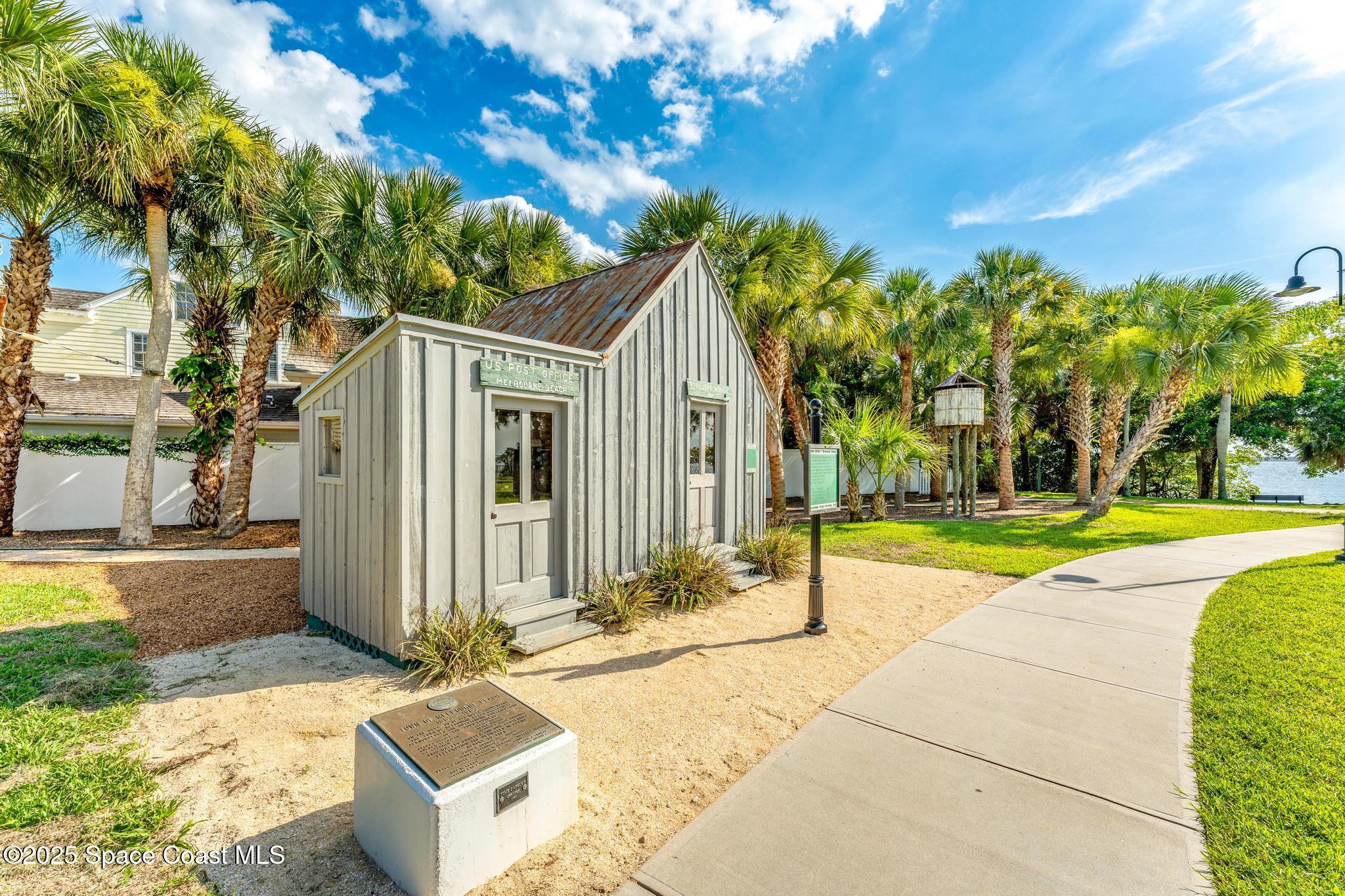 411 Poinsettia Road Melbourne Beach, FL 32951 - Photo 59 of 78 a front view of a house with a yard