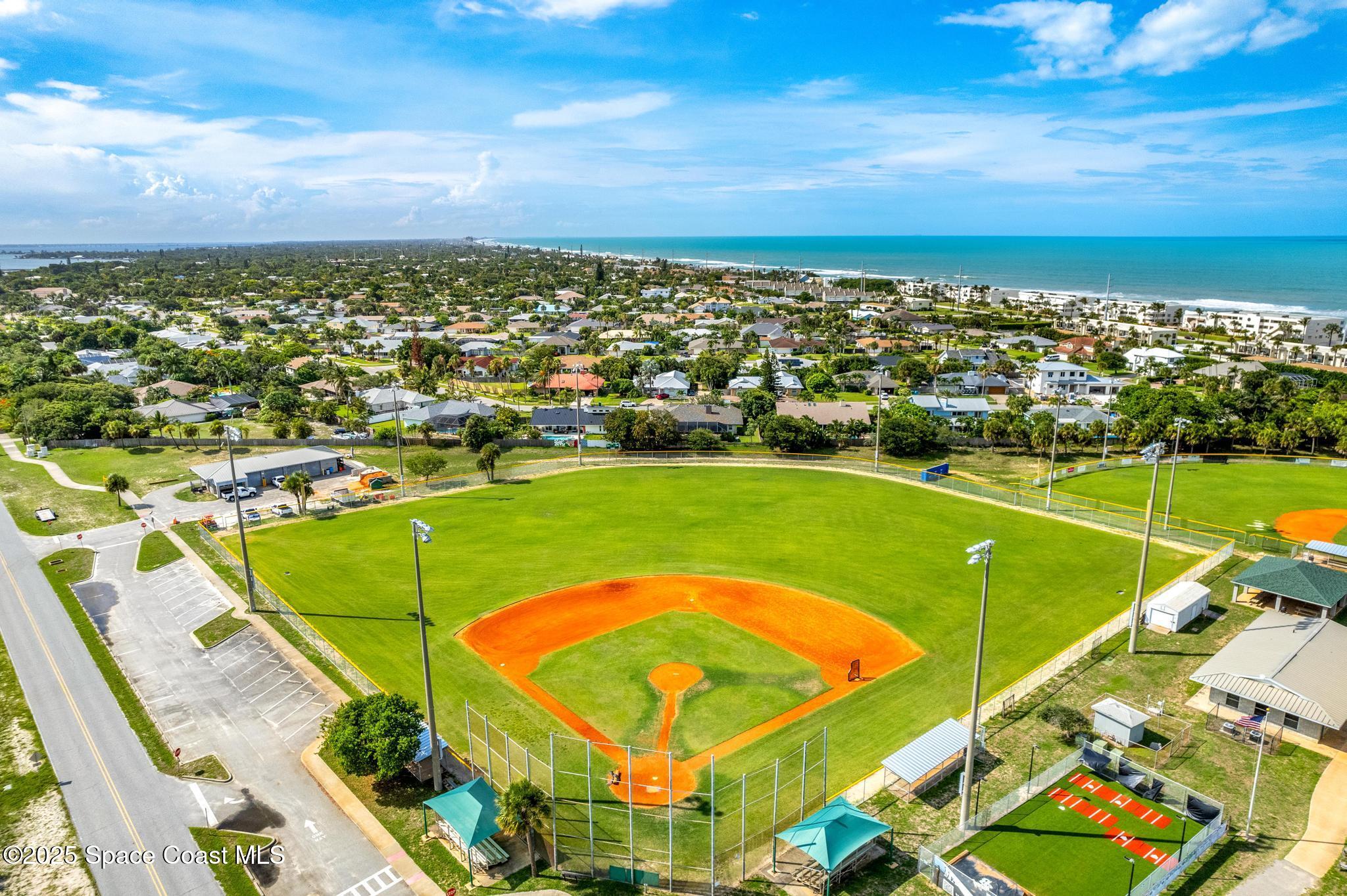 411 Poinsettia Road Melbourne Beach, FL 32951 - Photo 70 of 78 an aerial view of a tennis ground and a city