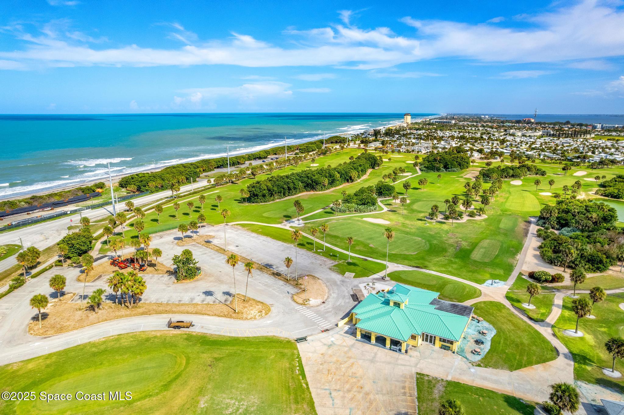 411 Poinsettia Road Melbourne Beach, FL 32951 - Photo 75 of 78 a view of an swimming pool and an outdoor seating