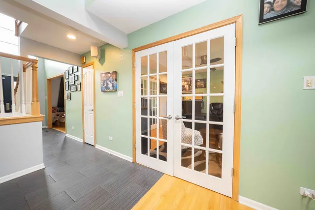 a view of an entryway with wooden floor and windows
