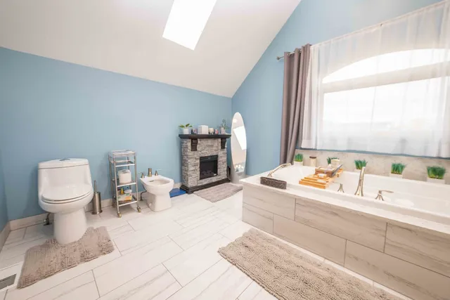 a room with a washing machine and sink