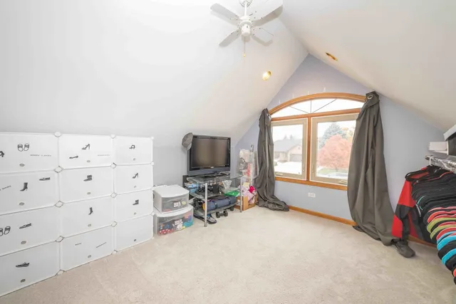 a view of a livingroom with workspace and a window