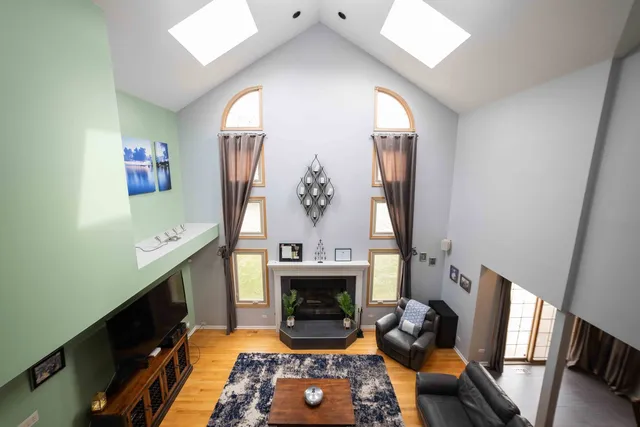 a living room with furniture and a fireplace