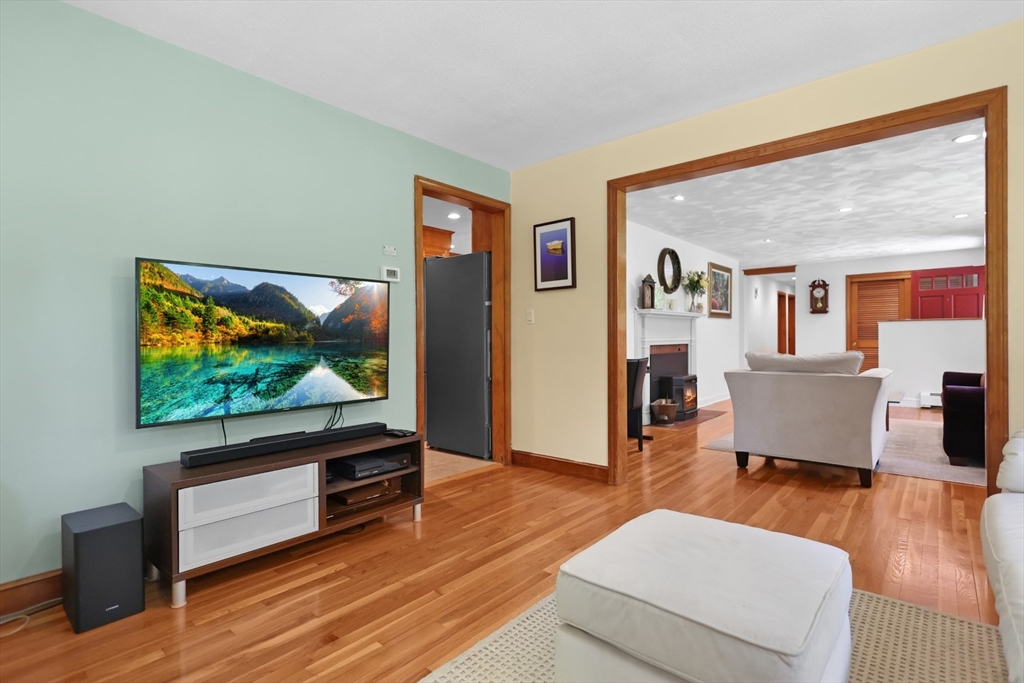401 River Road Andover, MA 01810 - Photo 6 of 32 a living room with furniture flat screen tv and wooden floor