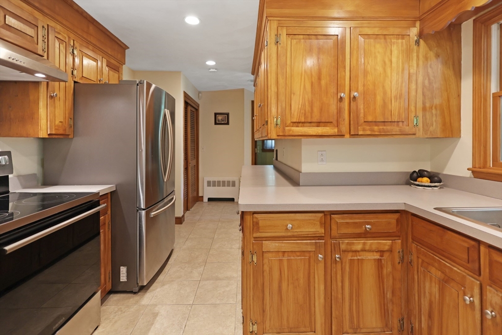 401 River Road Andover, MA 01810 - Photo 10 of 32 a kitchen with a refrigerator and a sink