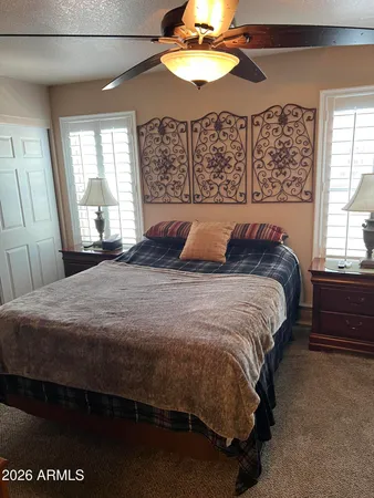 a bedroom with a bed and a window