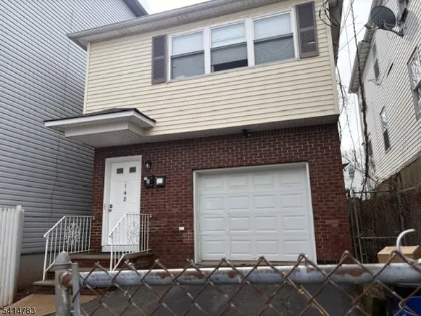 a front view of house with chairs