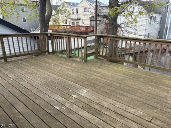 a view of balcony with wooden floor