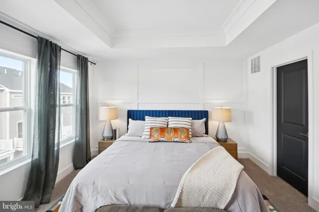 a bedroom with a large bed and a couch