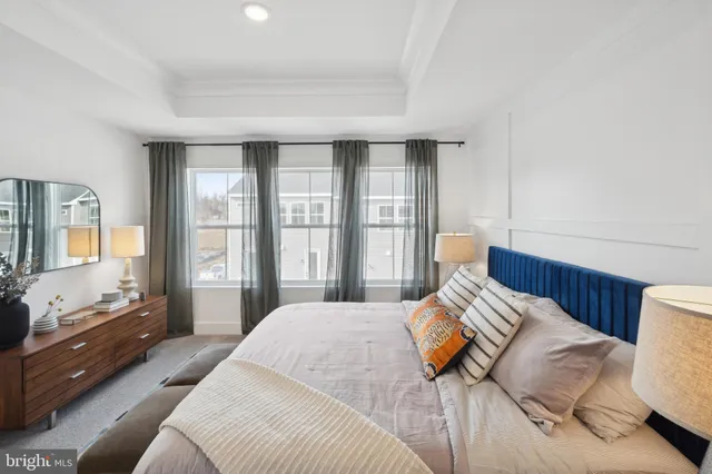 a bathroom with a shower sink vanity and mirror