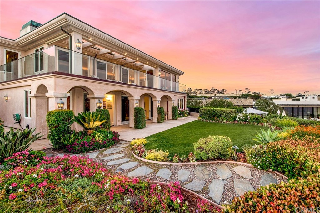 33 Monarch Bay Drive Dana Point, CA 92629 - Photo 3 of 46 a front view of a house with a yard