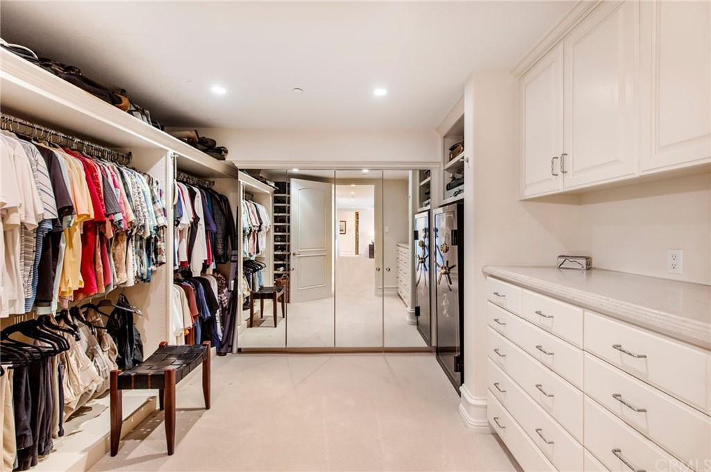 33 Monarch Bay Drive Dana Point, CA 92629 - Photo 22 of 46 a view of walk in closet with clothes and shoes
