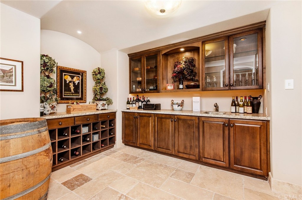 33 Monarch Bay Drive Dana Point, CA 92629 - Photo 24 of 46 a kitchen with stainless steel appliances granite countertop a stove and cabinets