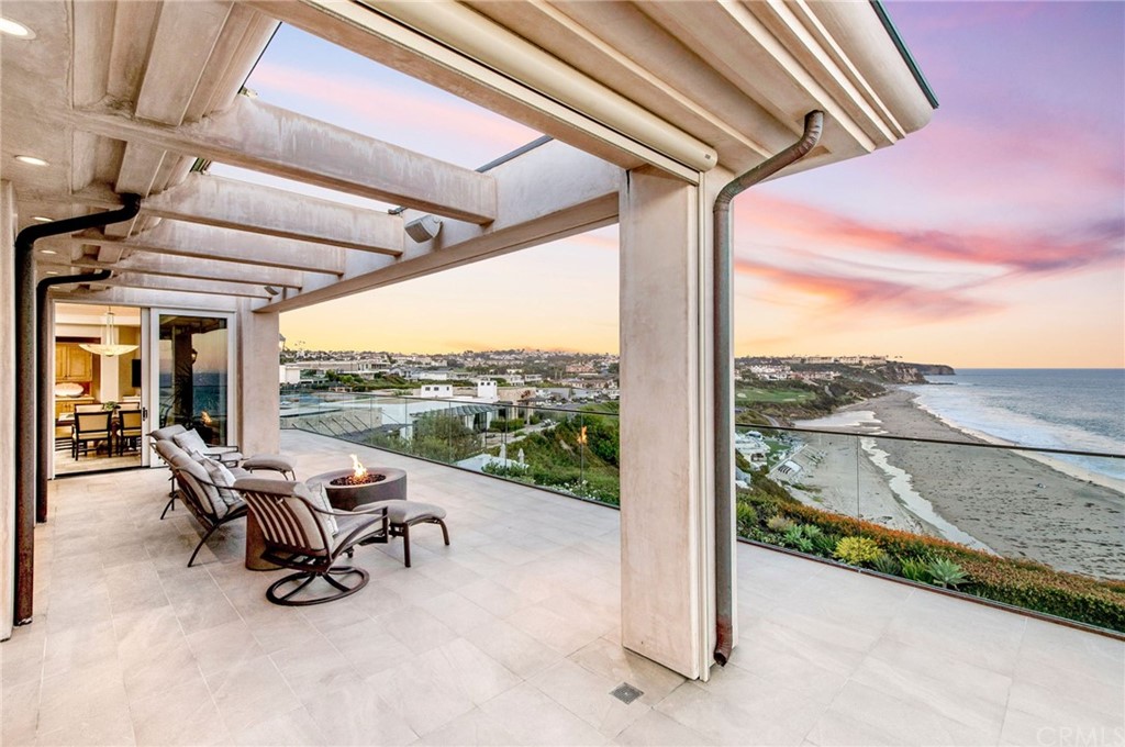 33 Monarch Bay Drive Dana Point, CA 92629 - Photo 4 of 46 a roof deck with table and chairs
