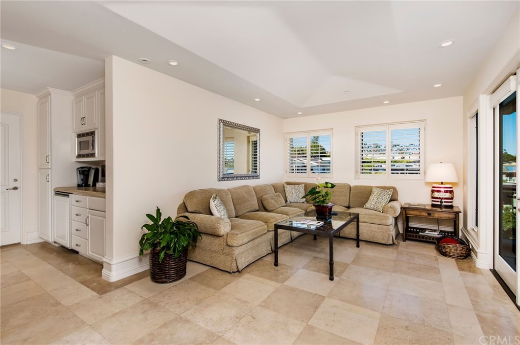 33 Monarch Bay Drive Dana Point, CA 92629 - Photo 33 of 46 a living room with furniture potted plant and windows
