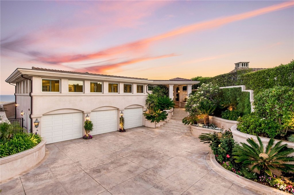 33 Monarch Bay Drive Dana Point, CA 92629 - Photo 44 of 46 a view of a patio with table and chairs under an umbrella