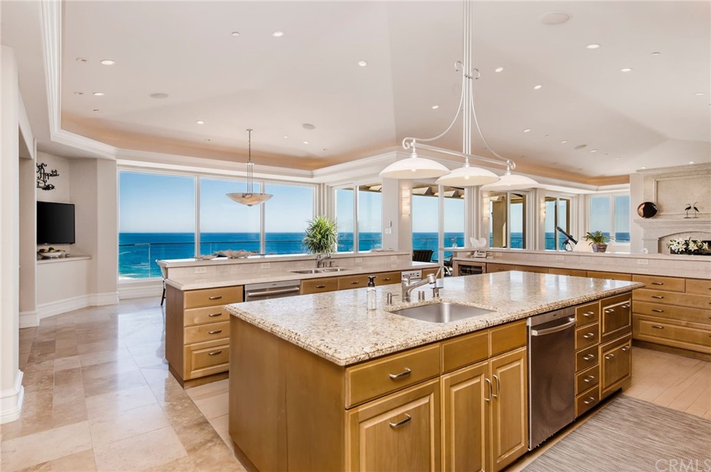 33 Monarch Bay Drive Dana Point, CA 92629 - Photo 10 of 46 a kitchen with stainless steel appliances granite countertop a sink and a stove