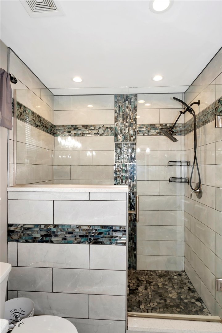 16364 Celtic Circle Manhattan, IL 60442 - Photo 18 of 31 a bathroom with a shower