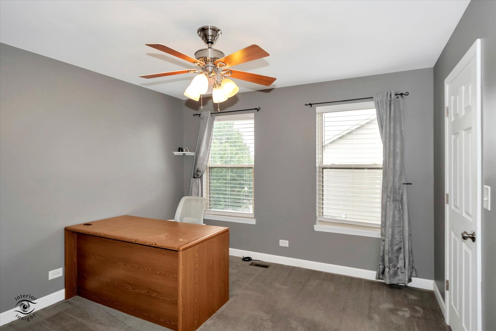 16364 Celtic Circle Manhattan, IL 60442 - Photo 21 of 31 a living room with a ceiling fan and a window
