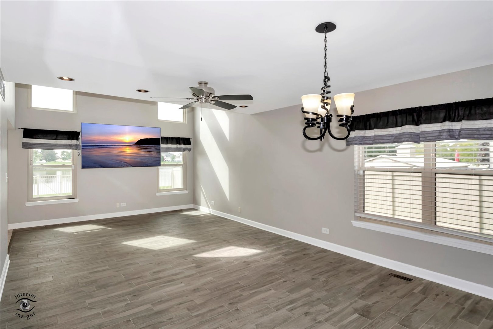 16364 Celtic Circle Manhattan, IL 60442 - Photo 9 of 31 a view of a room with wooden floor ceiling fan and windows