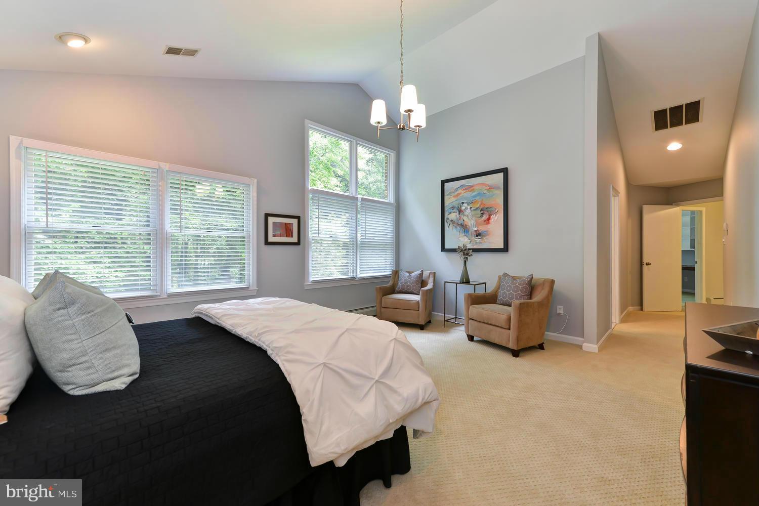 243 Springvale Road Great Falls, VA 22066 - Photo 15 of 30 a spacious bedroom with a bed and window