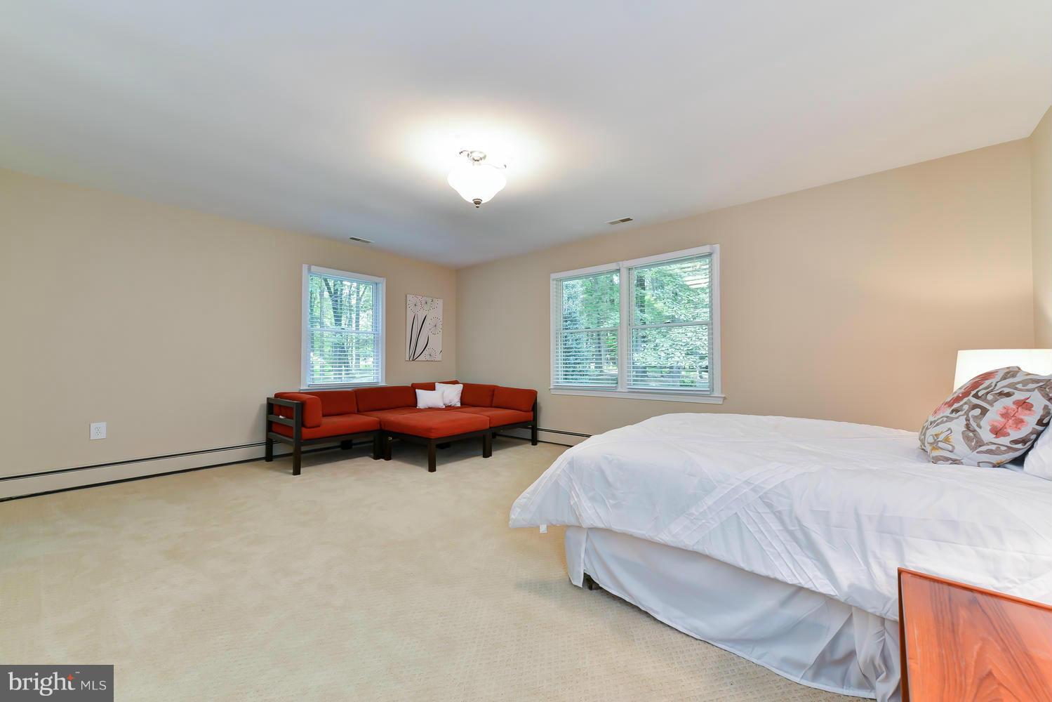 243 Springvale Road Great Falls, VA 22066 - Photo 19 of 30 a bedroom with bed and a window